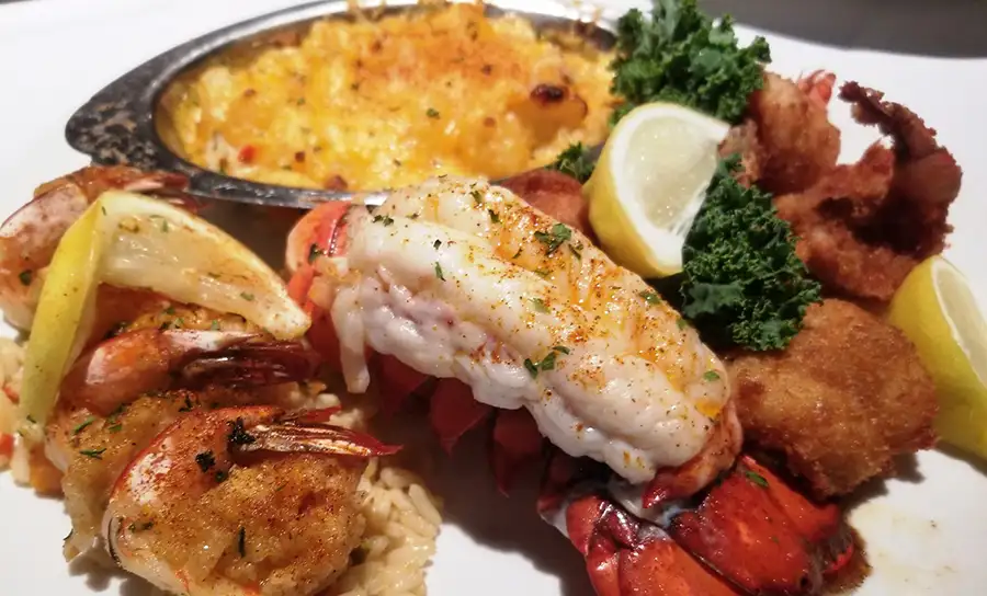 Chesapeake Seafood House - featured menu items - Lobster Tail, crab meat stuff shrimp, fried shrimp, & crab legs - Springfield, IL